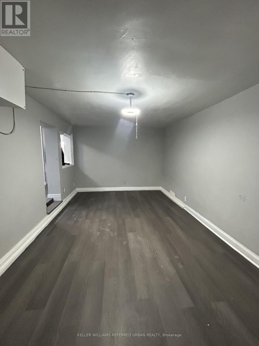 A room with a wooden floor and a white ceiling.