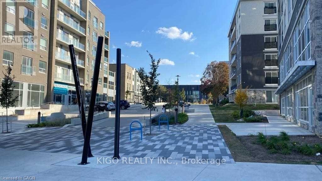 A sunny day at a residential area with apartment buildings and a playground.