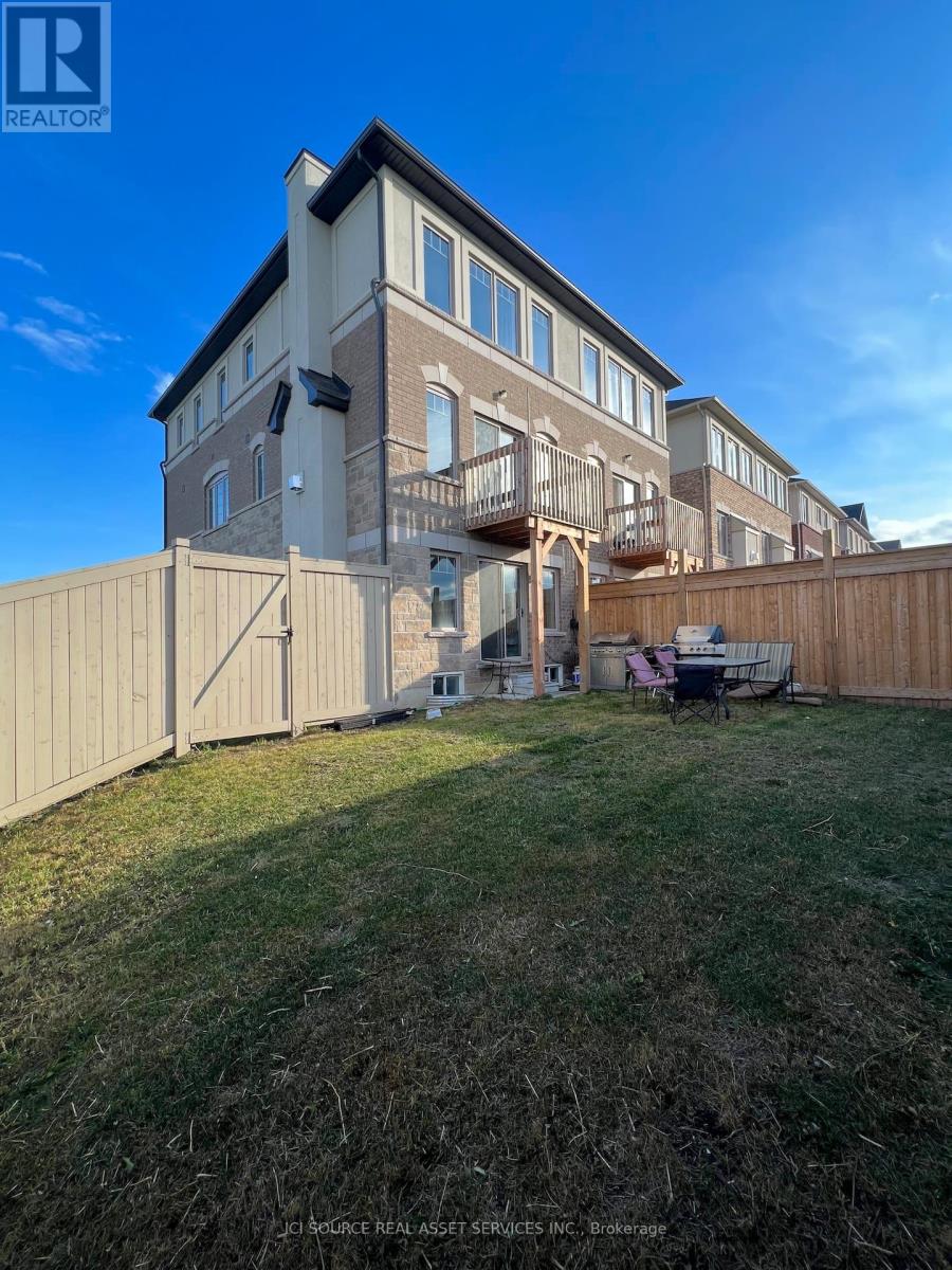 A building with a balcony and a fence in front of it.