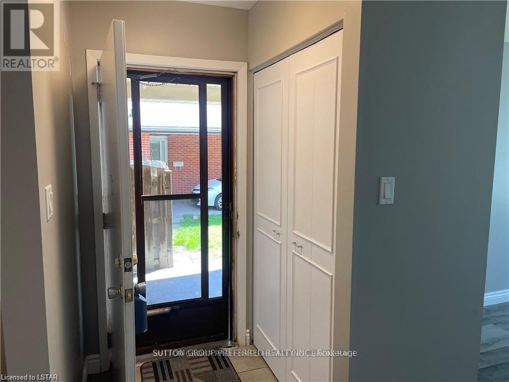 A doorway with a glass door leading to a balcony.