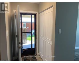 A doorway with a glass door leading to a balcony.