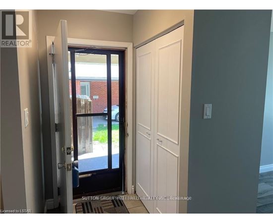A doorway with a glass door leading to a balcony.
