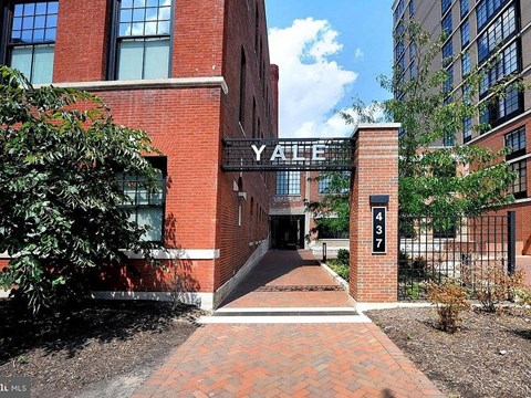 A brick building with a sign that says Yale.