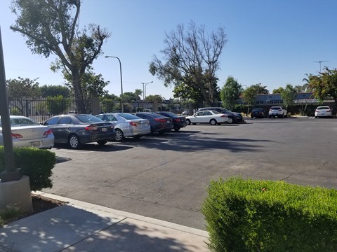 A parking lot with several cars parked in it.