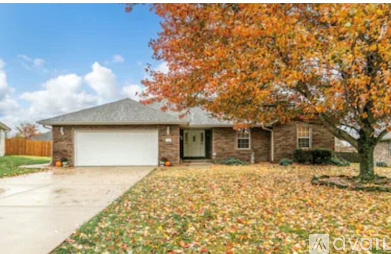 A house with a tree in front of it.