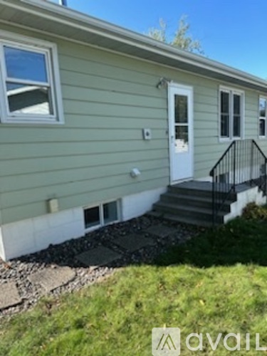 A house with a white door and windows.
