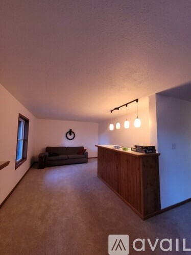 A living room with a couch and a coffee table.