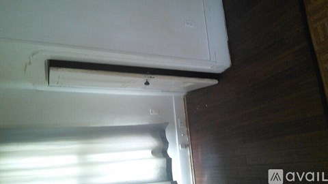 A white air conditioner unit is installed on a wall.