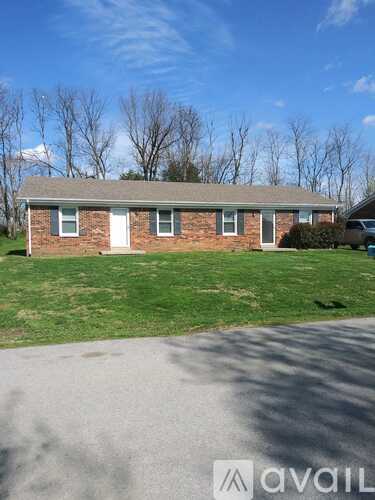 A house with a driveway in front of it.
