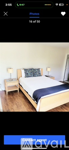 A bedroom with a bed and a nightstand.
