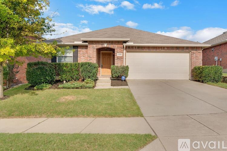 A house with a brown garage door and a driveway.