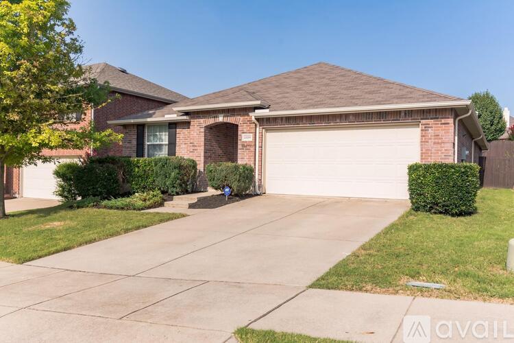 A house with a garage and a driveway.