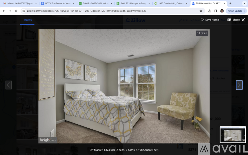 A bedroom with a bed and a chair is on the market.