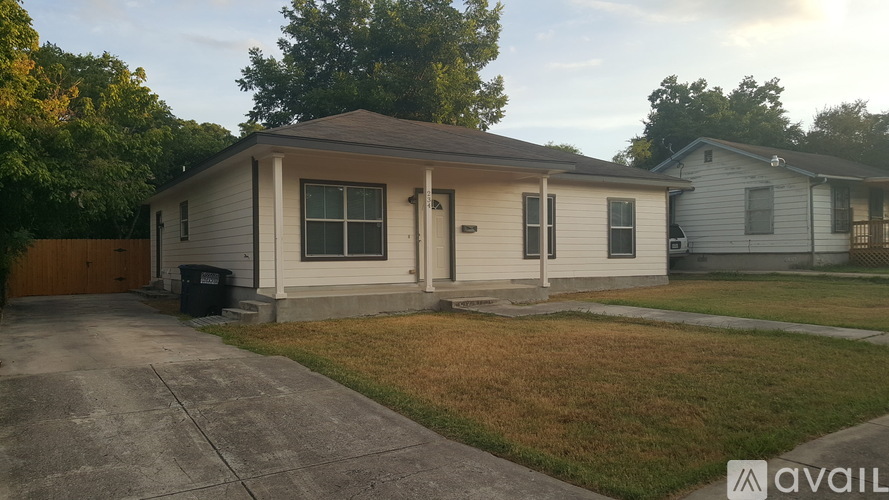 A house with a brown roof and a grey siding is available for rent.