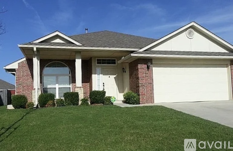 A house with a garage and a driveway.