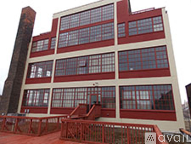 A large red and white building with a lot of windows.
