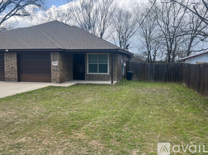 A house with a brown roof and a brown garage door.