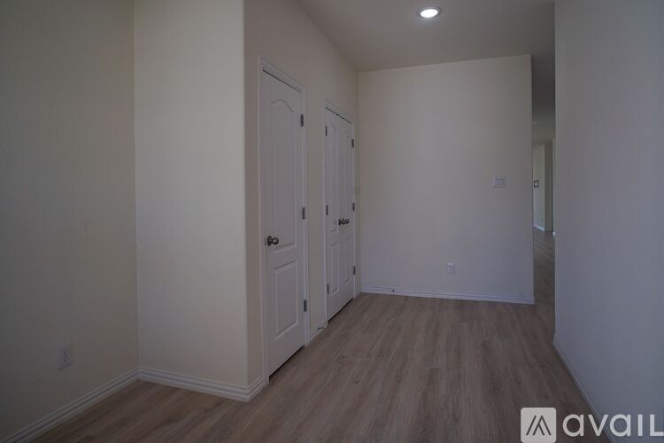 A room with a door and a window.