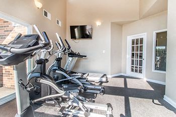 fitness center with cardio machines