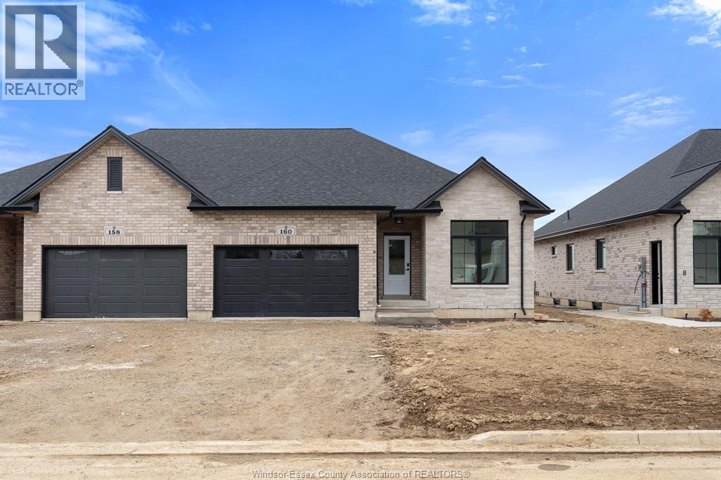 A real estate photo of a house with a garage.