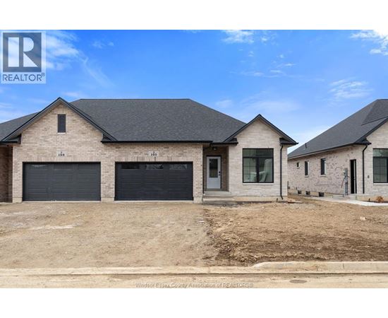 A real estate photo of a house with a garage.