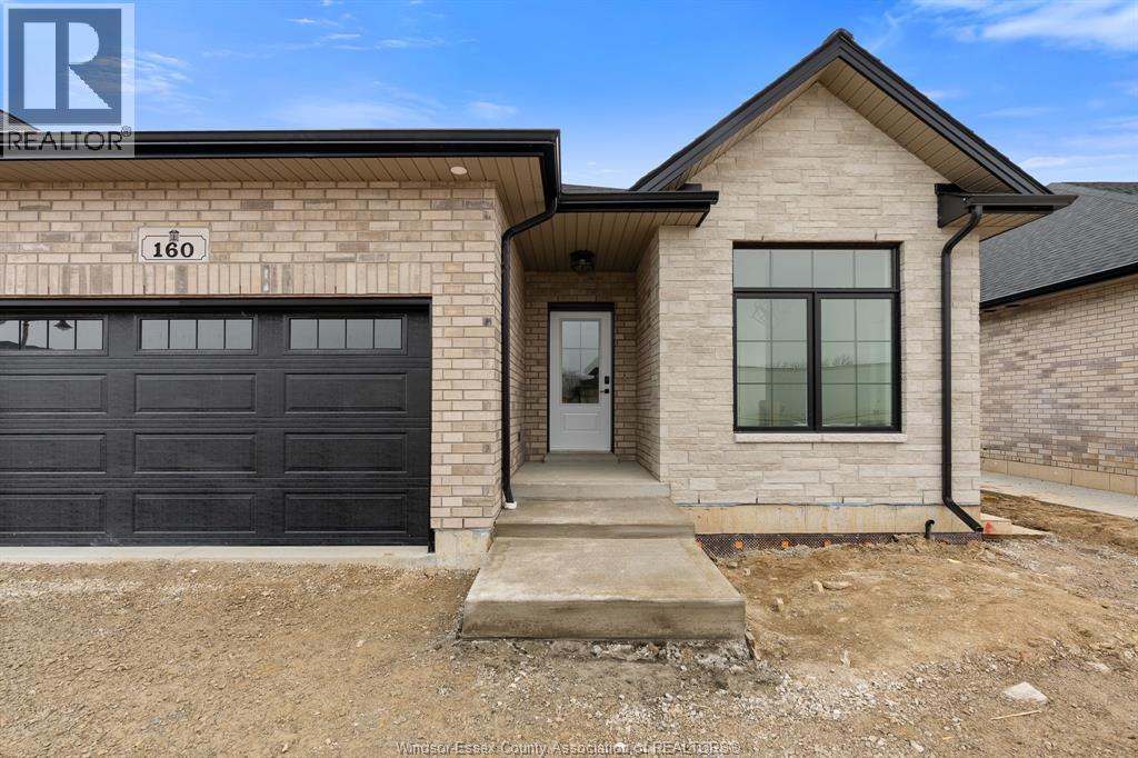 A house with a garage is for sale.