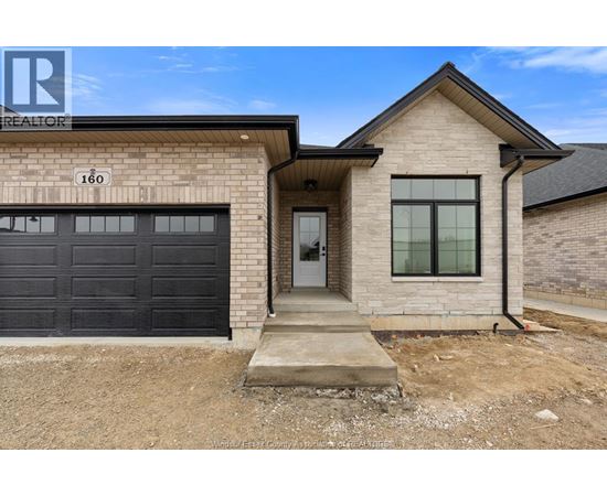 A house with a garage is for sale.