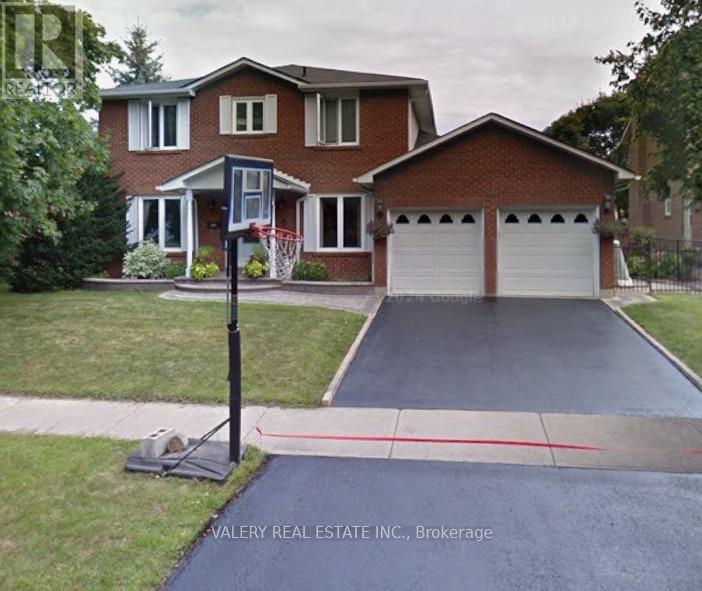 A house with a driveway and a sign that says Valery Real Estate Inc., Brokerage.