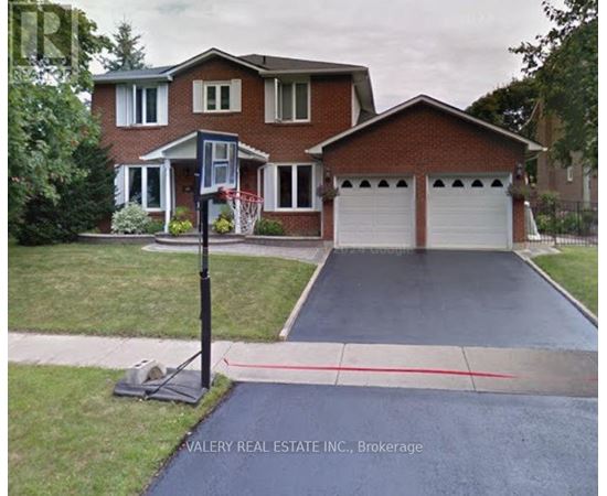 A house with a driveway and a sign that says Valery Real Estate Inc., Brokerage.