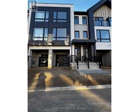 A building with a sign that says RE/MAX WEST REALTY INC. Brokerage.