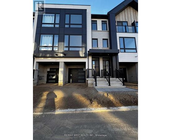 A building with a sign that says RE/MAX WEST REALTY INC. Brokerage.
