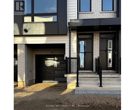 A modern house with a black front door and windows.