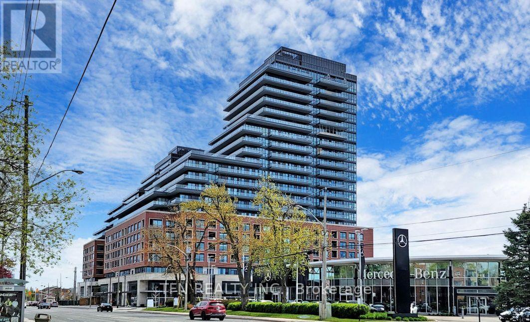 A tall building with a Mercedes sign in front of it.