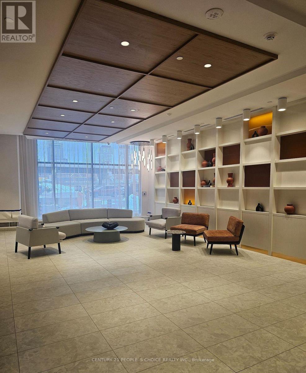 A conference room with a long table and chairs.