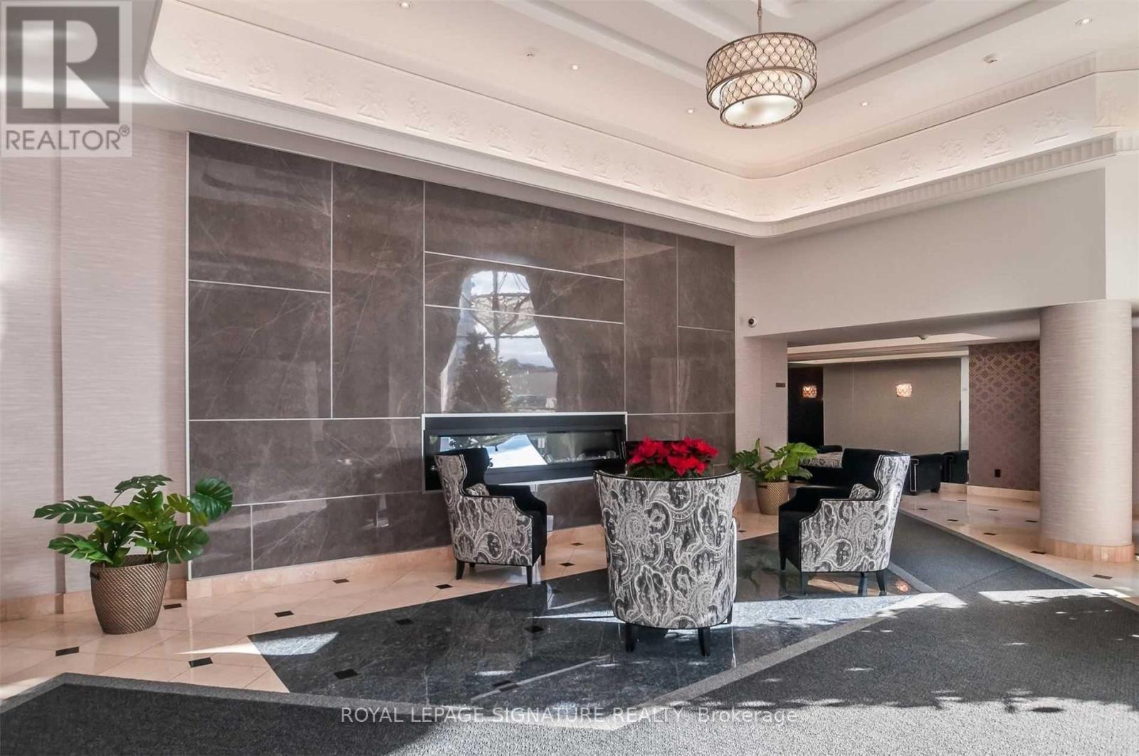 A modern living room with a black and white color scheme.