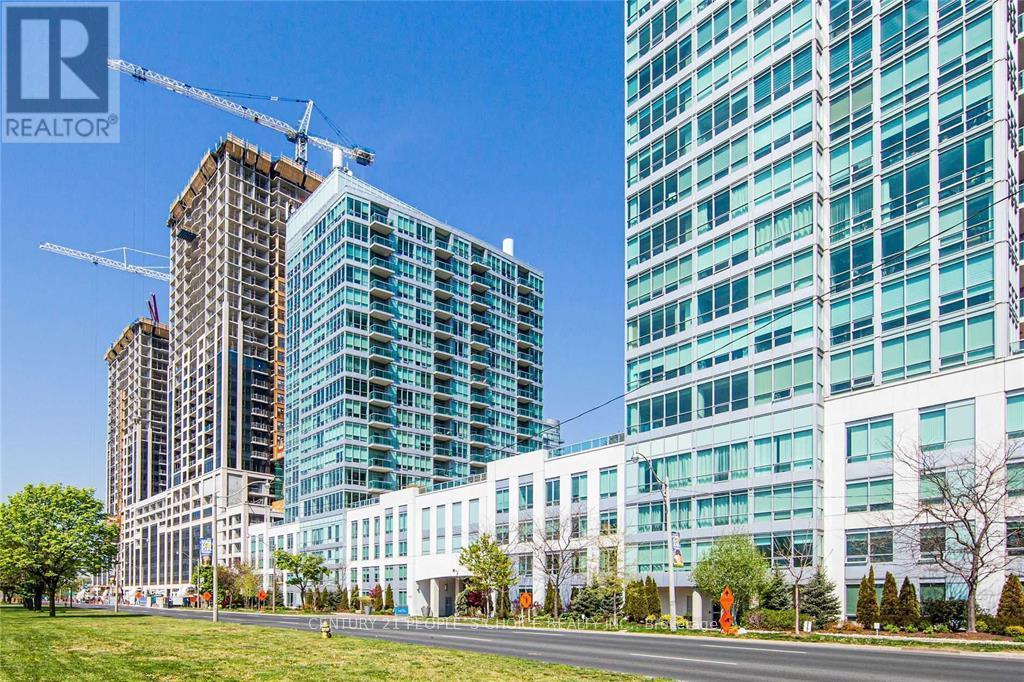 A cityscape with a large building under construction and a completed building to the right.