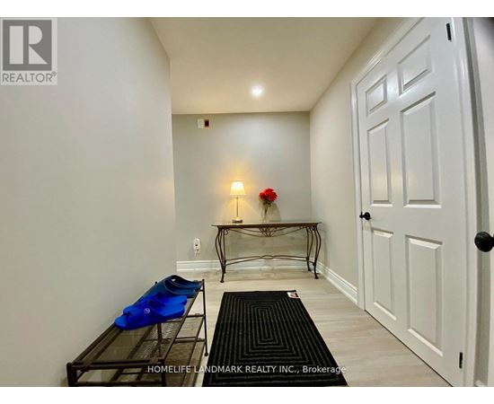 A hallway with a bench and a door.