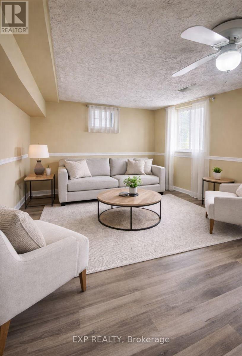 A living room with a couch, chair, and coffee table.