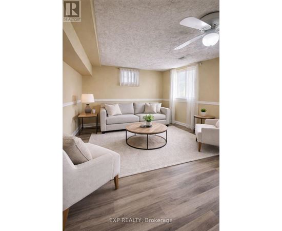 A living room with a couch, chair, and coffee table.