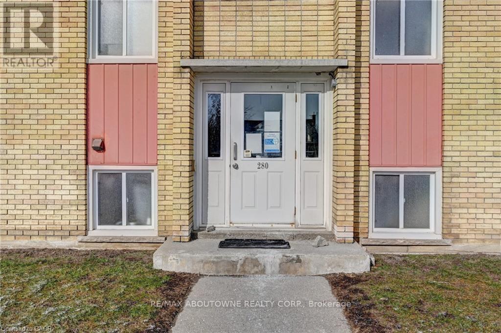 A house with a white door and windows with a sign that says REALTOR.