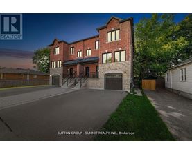 A rendering of a multi-story brick building with a garage door and a stone wall entrance.