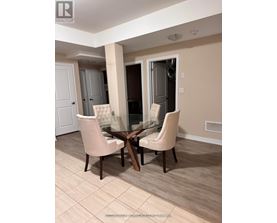 A dining room with a glass table and chairs.