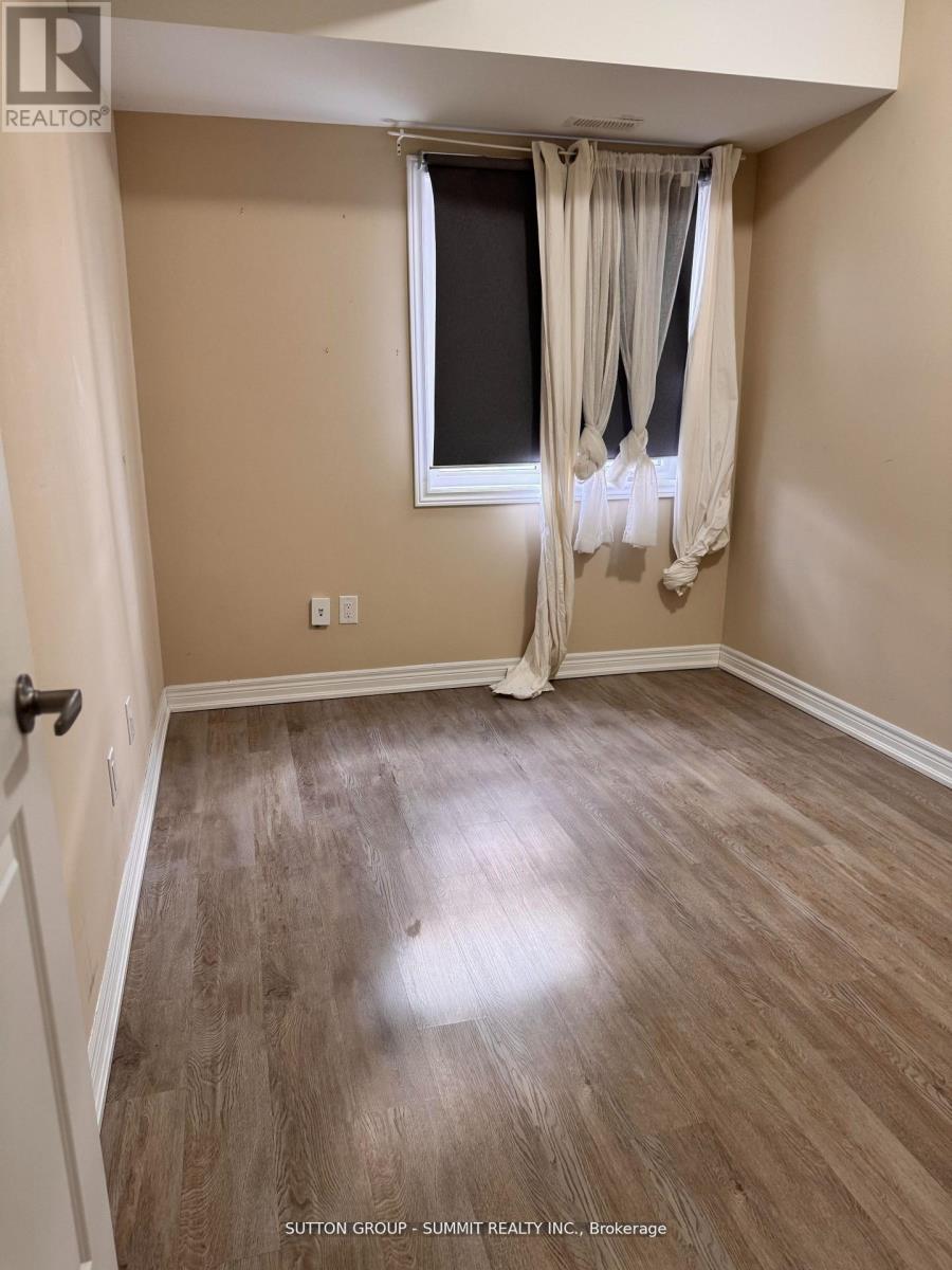A room with a window and a door.