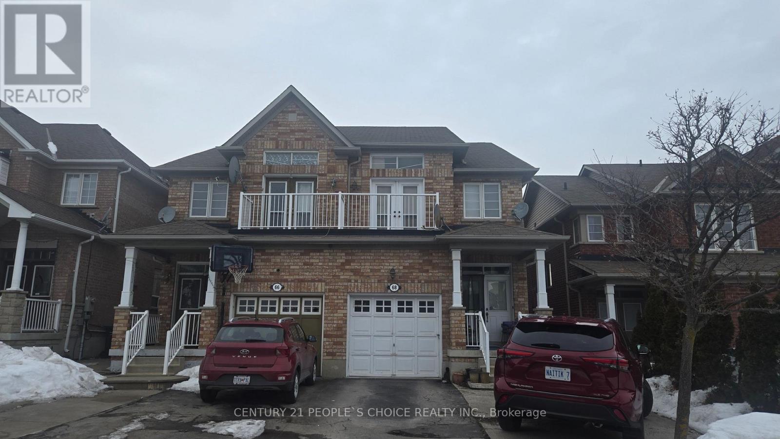 A house with a car parked in front of it.