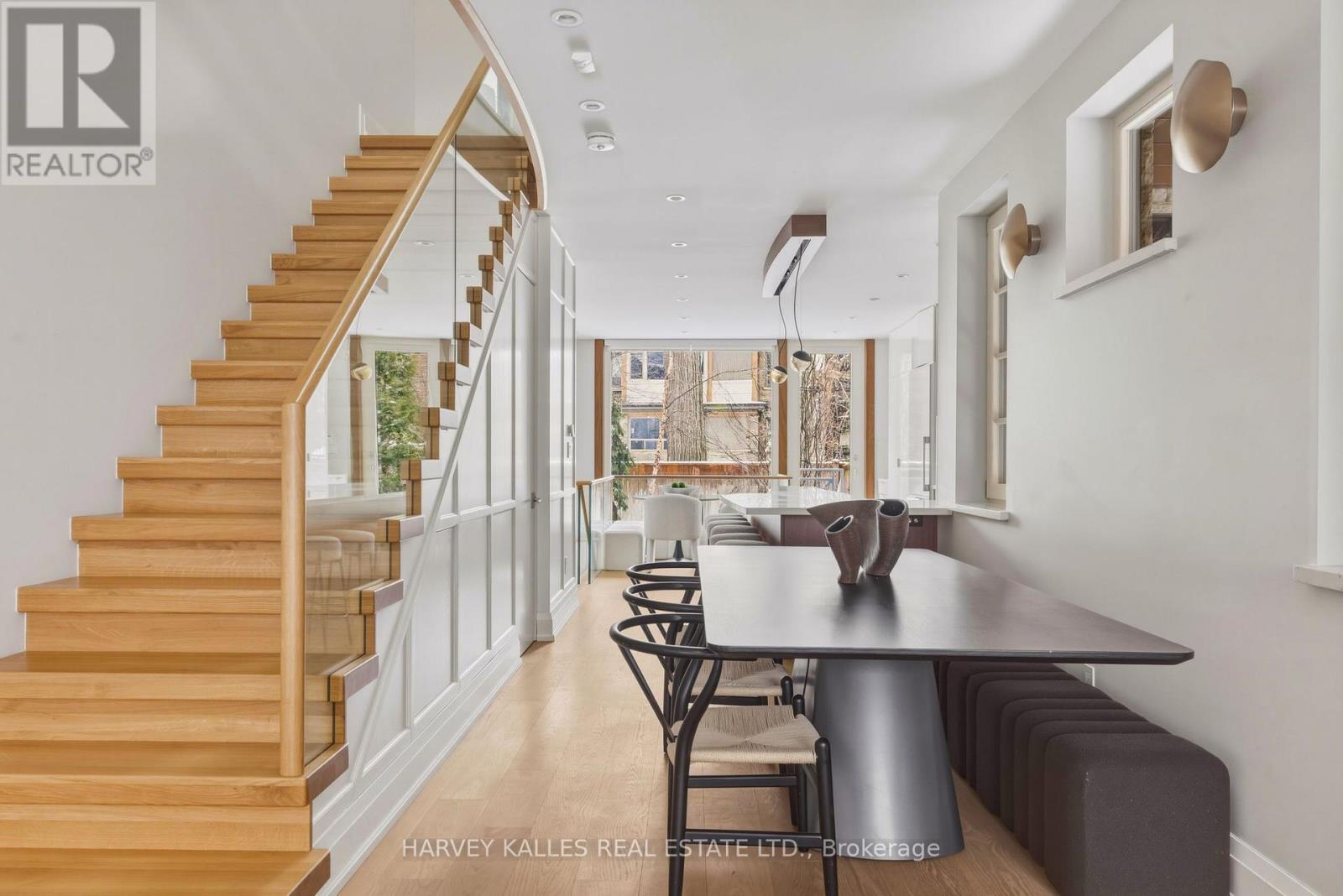 A dining area with a table and chairs is shown in the image.