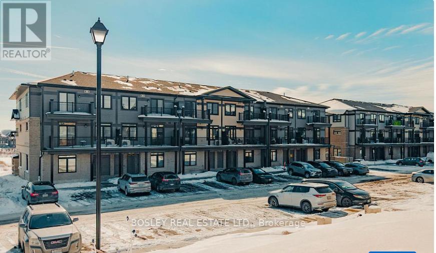 A large building with a parking lot in front of it.