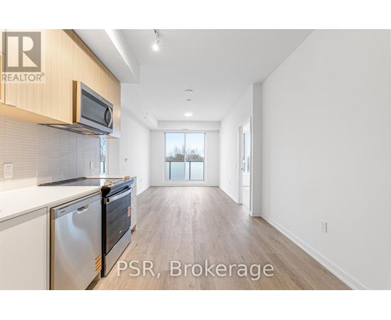 A kitchen with a microwave and oven above the counter.