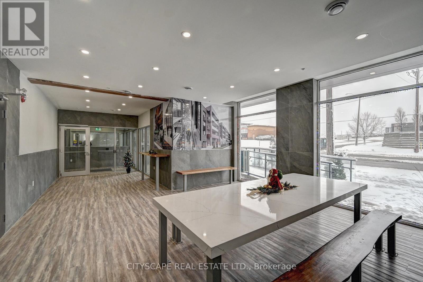 A modern interior space with a long table and bench seating.