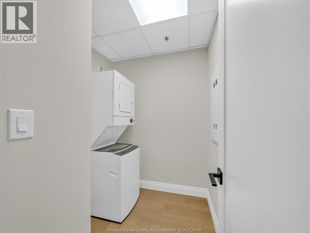 A white room with a small refrigerator and a cabinet on top of it.