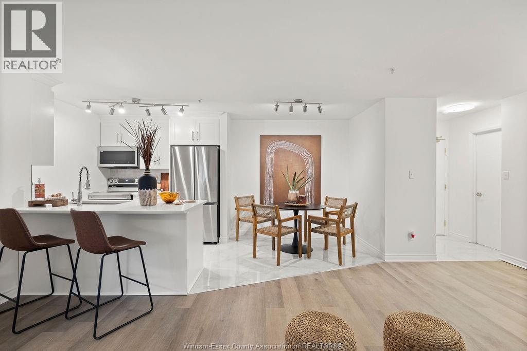 A modern kitchen with a dining table set up.